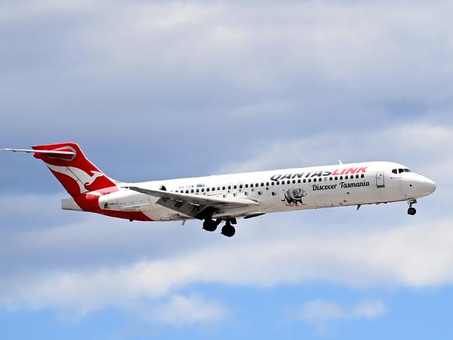 SYDNEY, AUSTRALIA - NewsWire Photos NOVEMBER 3, 2022: A QantasLink plane prepares to land at Sydney Domestic Airport.Picture: NCA NewsWire / Jeremy Piper