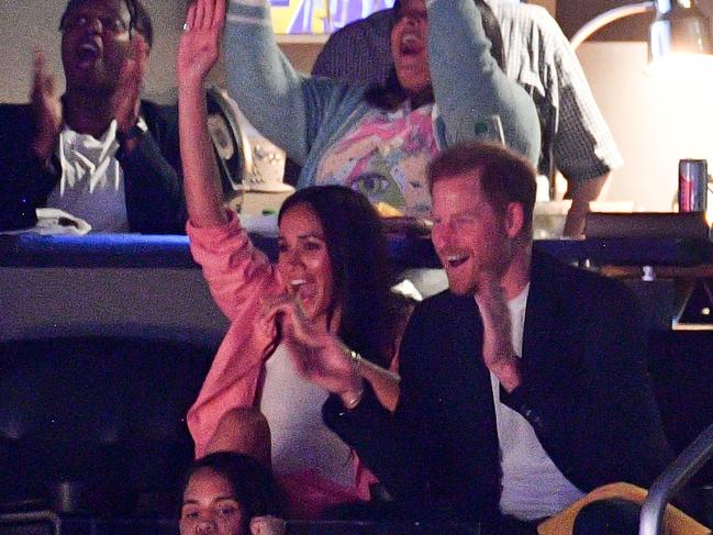 Prince Harry and Meghan Markle thrilled basketball fans with their appearance. Picture: Getty