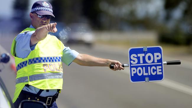 Members of Central Coast Highway Patrol conduct RBT on drivers, in the lead up to Christmas, at Wilfred Barrett Drive, North Entrance.