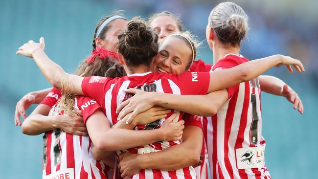 Jodie Taylor celebrates with teammates after scoring City second goal.