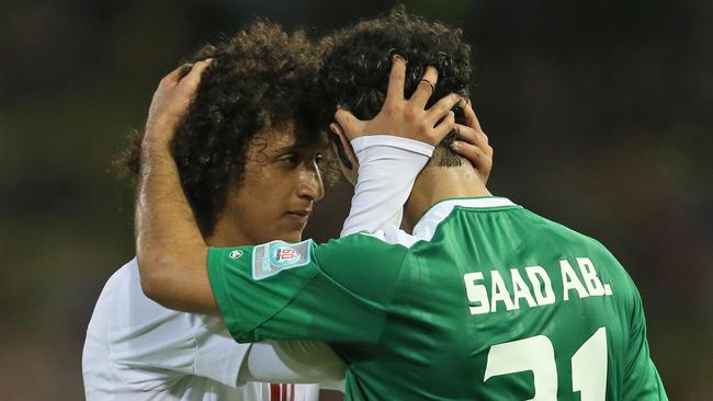 UAE's Omar Abdulrahman is congratulated by Iraq's Saad Abdulameer.