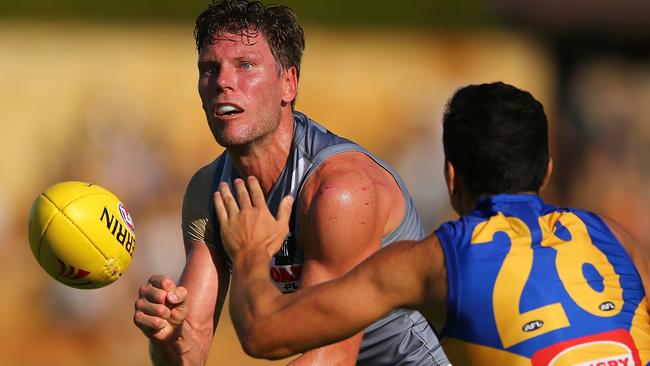 Brad Ebert handballs for the Power on Sunday. Picture: Getty Images