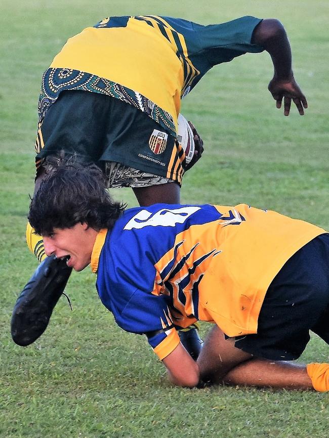 Matthew Spina, Gilroy, tackles around the laces. Photographs from the Will Murdoch Perpetual Shield. The annual U14 rugby league competition, in its second year, involved Gilroy Santa Maria College, Ingham State High School and St Teresa's Catholic College Abergowrie. Picture: Cameron Bates