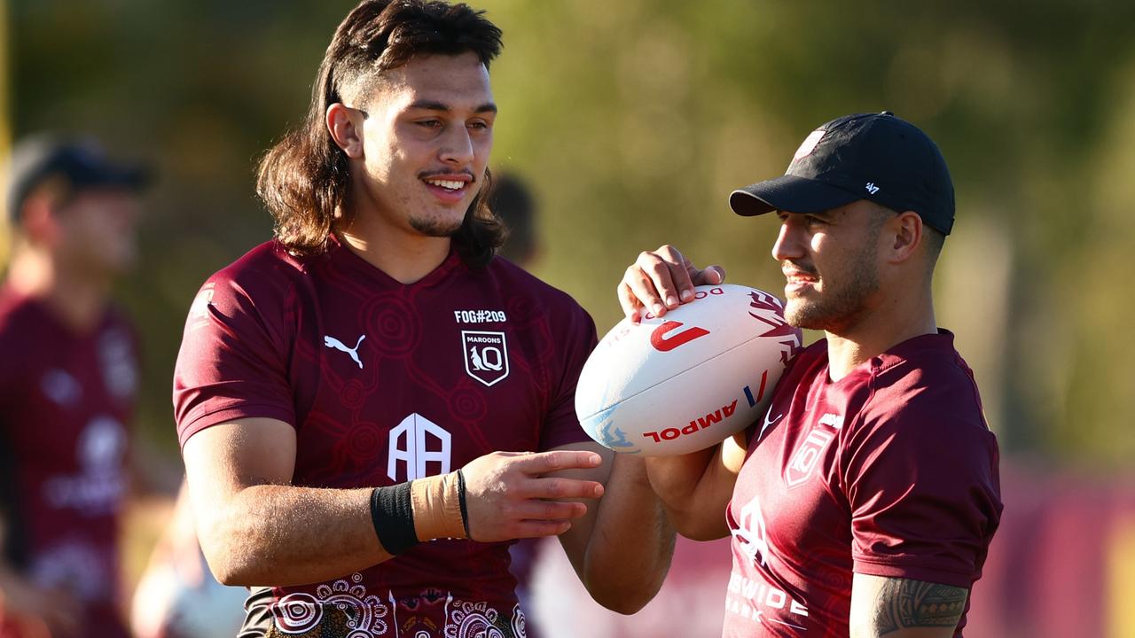 Tino Fa'asuamaleaui and Valentine Holmes during a Queensland training session at Sanctuary Cove. Picture: Chris Hyde/Getty Images