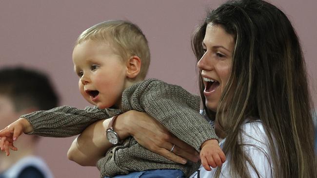 Jordan Ablett and son Levi cheer on dad Gary in a game last month. Pic: Michael Klein