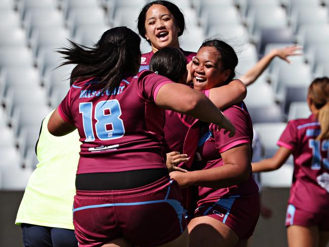 DAILY TELEGRAPH AUGUST 30, 2023. The Hills Sports High players celebrating their win over Erindale Sports Academy players for the NRL Schoolgirls Cup at Campbelltown Stadium.  Picture: Adam Yip