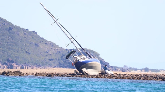 The Ingham Coast Guard confirmed on Monday that it was involved in a protracted and tricky rescue of a yacht and its sole passenger that had run aground on rocks and coral in waters between Hinchinbrook Island and Agnes Island on Saturday. Picture: Supplied