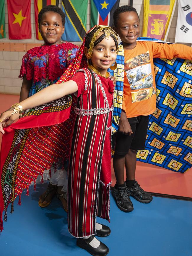 Representing their culture are (from left) Faith Bahati, Chum Ibrahim and Dieume Antoine at Harmony Day celebrations at Darling Heights State School. Picture: Kevin Farmer