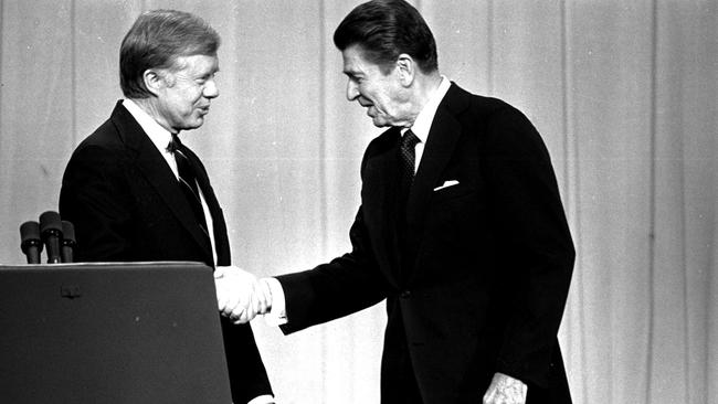 US President Jimmy Carter and Republican Presidential candidate Ronald Reagan shake hands in Cleveland in 1980, prior to debating before a nationwide television audience.