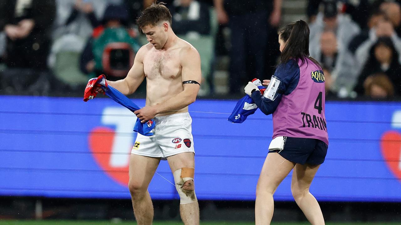 Jack Viney had his jumper ripped off in the scuffle. Picture: Michael Willson/AFL Photos via Getty Images