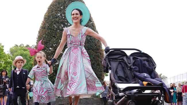 Families arrive during Seppelt Wines Stakes Day at Flemington Racecourse. Picture: Michael Dodge/AAP Image.