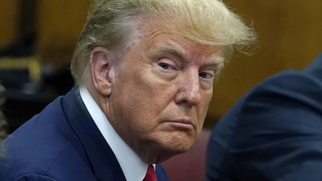 TOPSHOT - Former US president Donald Trump appears in court at the Manhattan Criminal Court in New York on April 4, 2023. - Former US president Donald Trump arrived for a historic court appearance in New York on Tuesday, facing criminal charges that threaten to upend the 2024 White House race. (Photo by Timothy A. CLARY / POOL / AFP)