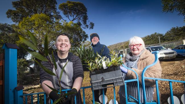 Understory Nursery volunteers Daniel Page and Leah McDougall with manager Mark Blaxall getting ready for their plant sale on August 29th. Picture: LUKE BOWDEN