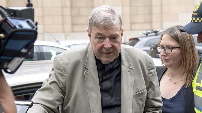 Cardinal George Pell arrives at the County Court in Melbourne. Picture: AP Photo/Andy Brownbill