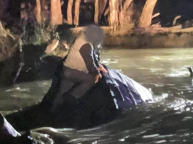 Two men, aged 73 and 46, were found clinging to their vehicle in fast-moving flood waters near Miepoll, in Victoria's northeast, on Friday night. Picture: Victoria Police.