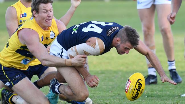 Seb Guilhaus brings down South Adelaide’s Tyson Brown. Picture: AAP Image/Keryn Stevens