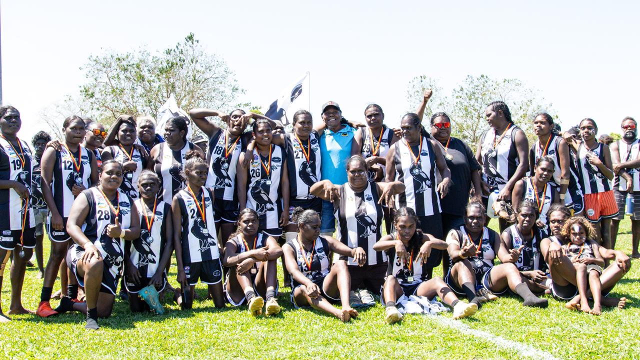 2024 Indigenous Round Honouree Mary Dunn with the inaugural Tiwi Islands Football League women's premiers Muluwurri Magpies (December 2023). Picture: Celina Whan.