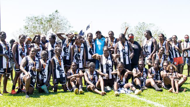 2024 Indigenous Round Honouree Mary Dunn with the inaugural Tiwi Islands Football League women's premiers Muluwurri Magpies (December 2023). Picture: Celina Whan.