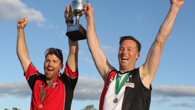 Bambill joint coaches Luke Stanbrook and Jeremy Weinert lift the premiership cup. Picture: Glenn Milne