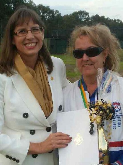 Wendy Lindsay congratulates Joanne Newman on her 50 years with the game.