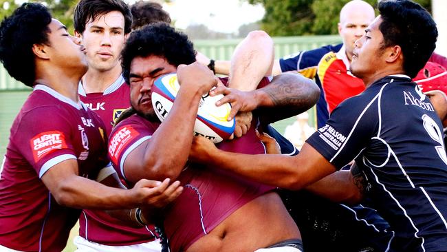 Premier Rugby top-of-the-table clash between Souths and UQ, at Chipsy Wood Oval. Tonga Ma'afu fights the ball up for University. Picture: Peter Cronin