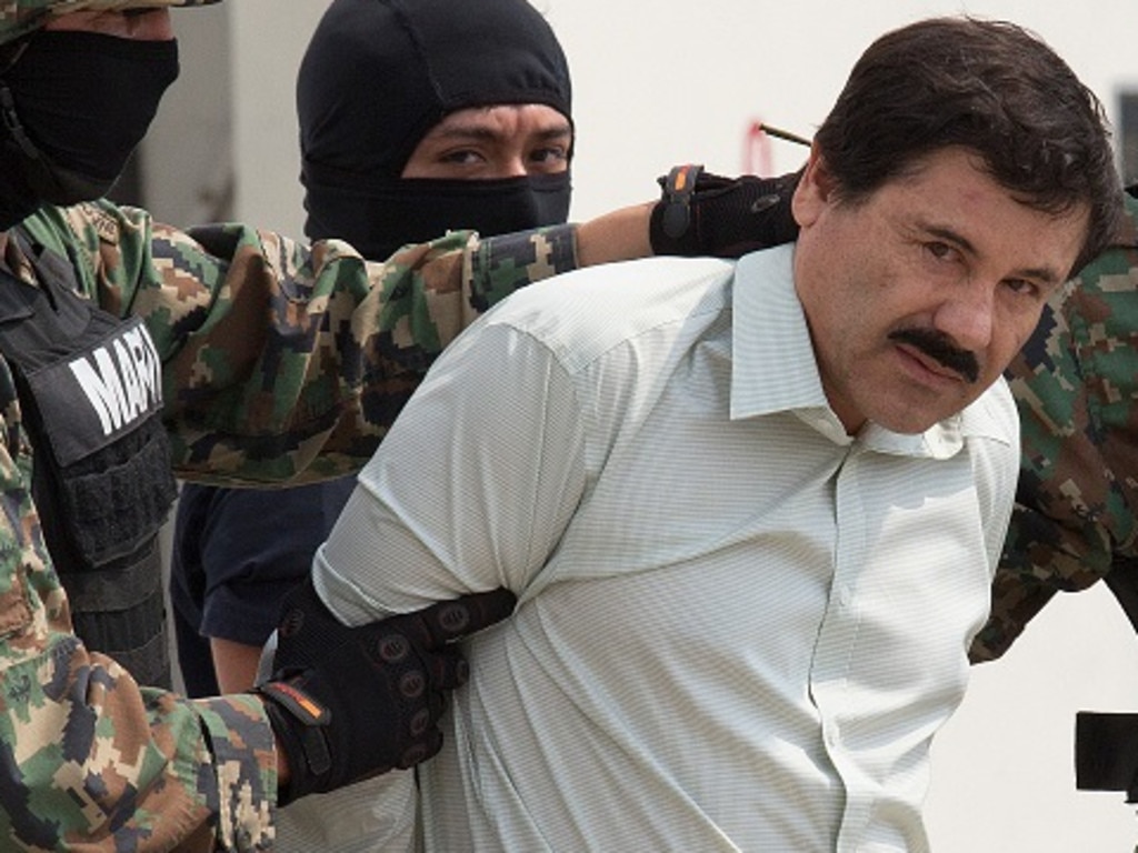 Drug trafficker Joaquin ‘El Chapo’ Guzman is taken to a helicopter by the Mexican Navy after his arrest in Sinaloa, Mexico City, in February 2014. Picture: Susana Gonzalez/Bloomberg