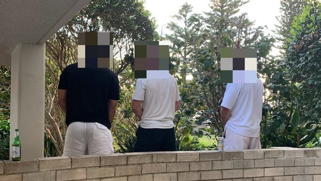 Three men, photographed urinating — in daylight — just metres form a public footpath in the private garden of the Matthew Bligh apartment block opposite East Esplanade Park at Manly. Picture: Supplied