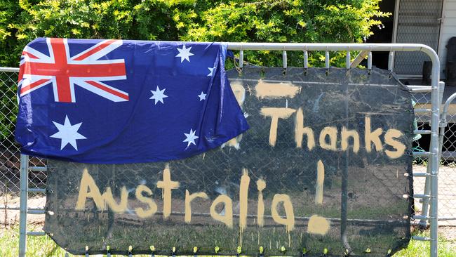 A thank you message is written in mud on a trampoline in the flood affected suburb of Goodna, south west of Brisbane on Tuesday, Jan. 18, 2011.
