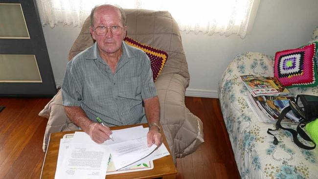 DOING IT TOUGH: South Grafton pensioner Alan Ryan with paperwork he has sent to the council and the NSW Government. Picture: Tim Howard