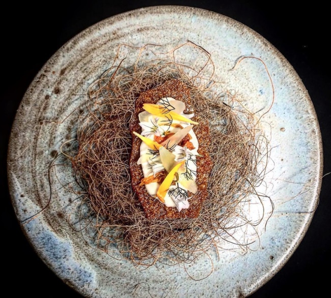 Onion crisp with smoked sheep's yoghurt and garfish at Amaru. Picture: Supplied