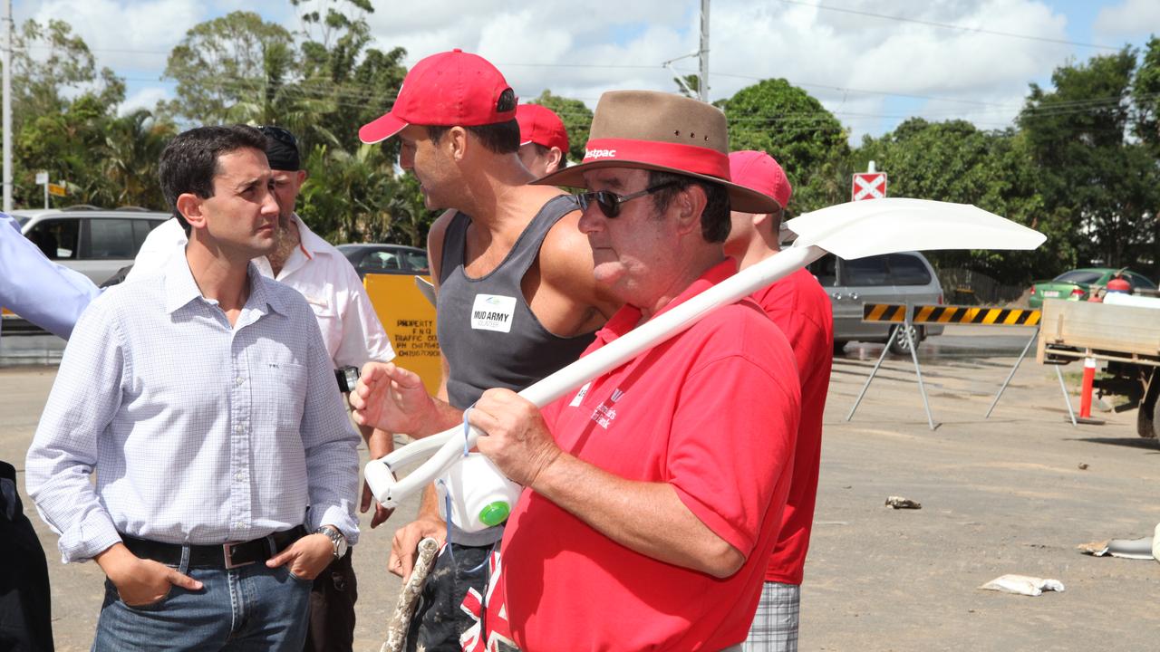 Then LNP Minister David Crisafulli talks with Mud Army volunteers, Mike Wright, 42 of Toowoomba &amp; Rod Kelly, 55 of Warwick in Bundaberg. Picture: Liam Kidston