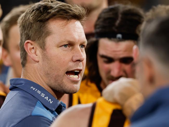 MELBOURNE, AUSTRALIA - AUGUST 5: Sam Mitchell, Senior Coach of the Hawks addresses his players during the 2023 AFL Round 21 match between the Hawthorn Hawks and the Collingwood Magpies at Melbourne Cricket Ground on August 5, 2023 in Melbourne, Australia. (Photo by Dylan Burns/AFL Photos via Getty Images)