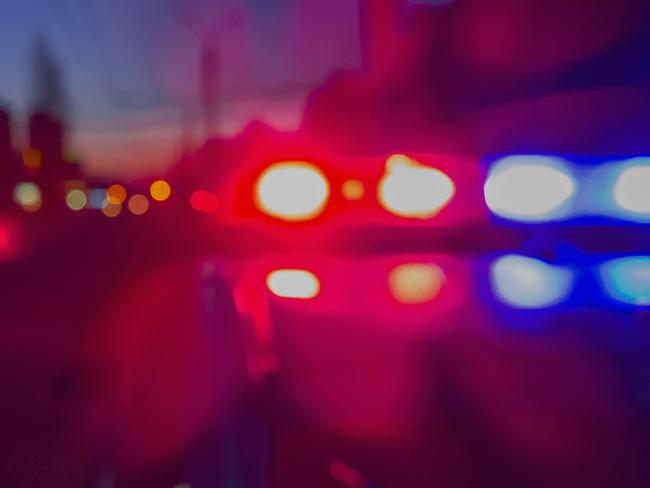 Red and blue Lights of police car in night time. Night patrolling the city. Abstract blurry image.