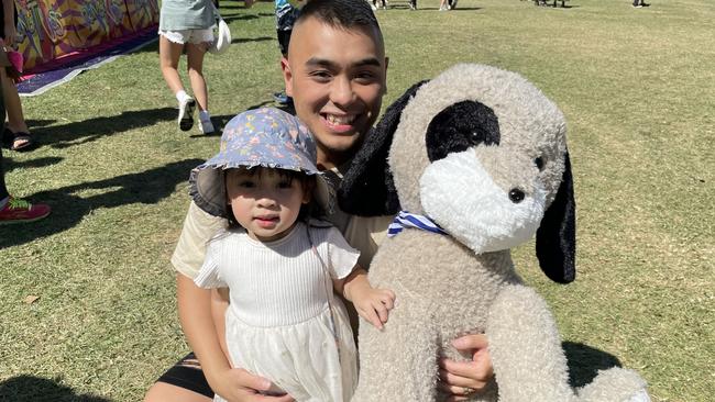 Maribyrnong's Minh Tran with daughter Amelia, 3, and the giant dog they won at Moomba on Saturday, March 11.