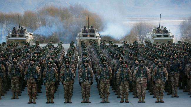 Chinese People's Liberation Army soldiers assemble during military training at Pamir Mountains in Kashgar, northwestern China's Xinjiang region, in January. Picture: AFP