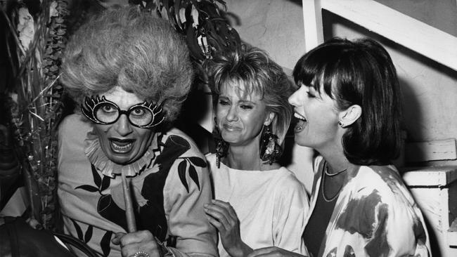 Humphries as Dame Edna with Olivia Newton-John and Pat Carroll Farrar in Beverly Hills in 1983. Picture: Getty Images