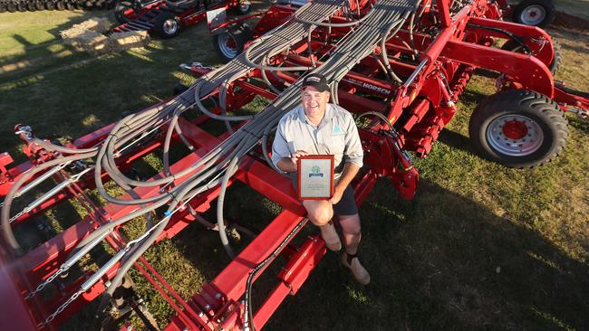 Sitting top: Jason Lummis shows the Imported Machine of the Year award for Horsch’s Muddy River 12 NT Sprinter. Pictures: Yuri Kouzmin