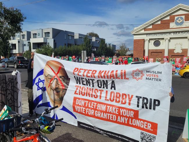 Tensions escalated at the Wills early voting centre in Brunswick on Saturday after a sign was displayed by Muslim votes matter, calling Peter Khalil, the Labor candidate a Zionist, and showing an edited image of him in a Israeli-flag tracksuit. Picture: Supplied