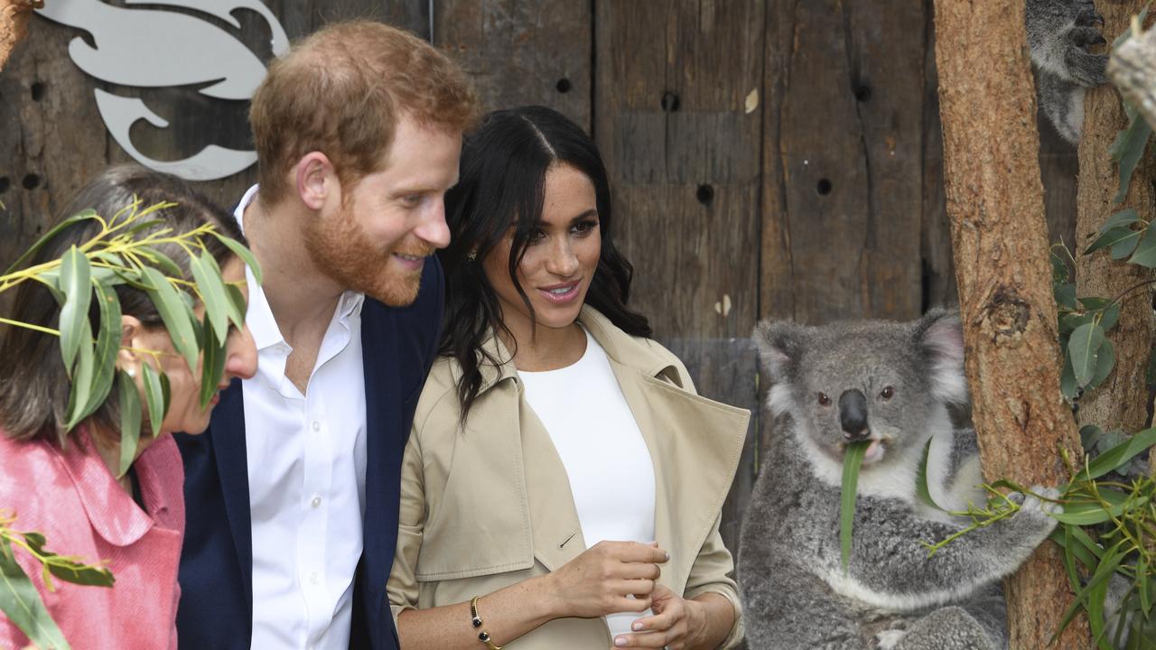 Britain's Prince Harry and Meghan, Duchess of Sussex meet Ruby a mother Koala who gave birth to koala joey Meghan, named after Her Royal Highness, with a second joey named Harry after His Royal Highness during a visit to Taronga Zoo in Sydney, Australia, Tuesday, Oct. 16, 2018. Picture: (Dean Lewins/Pool via AP)