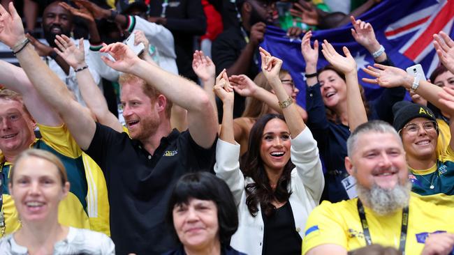 Prince Harry and Meghan Markle sat with the Australian team and supporters at the Invictus Games in Dusseldorf. Picture: Getty Images for the Invictus Games Foundation