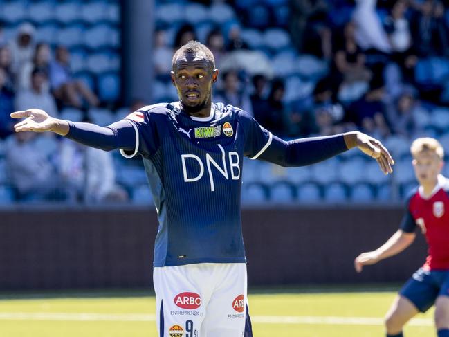 Jamaican sprint legend Usain Bolt reacts during the friendly football match between Stromsgodset and Norway's U19 team at Marienlyst Stadium in Drammen, Norway, June 5, 2018.  / AFP PHOTO / NTB scanpix AND NTB Scanpix / Vidar RUUD / Norway OUT