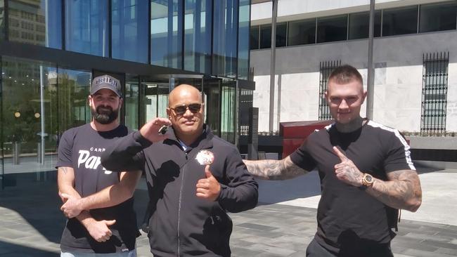 Comancheros Canberra president Pitasoni Ulavalu (centre) appeared in ACT Magistrates Court.