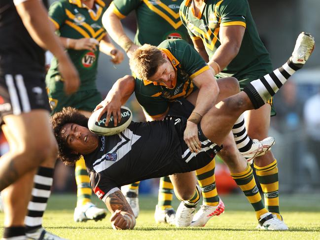 Chris Lawrence tackles Kiwi Fuifui Moimoi during a Test in 2011.