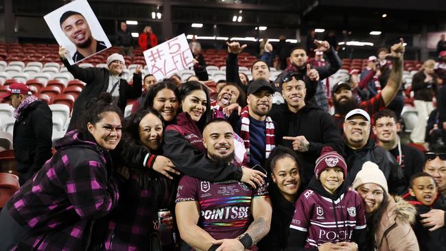 NRL debutant Alfred Smalley of the Sea Eagles poses with family and friends after the game. Picture: Cameron Spencer/Getty Images