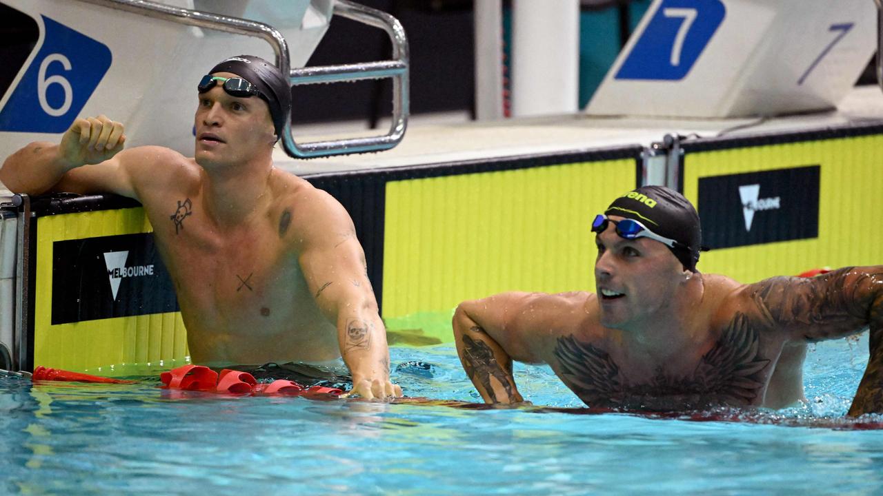 Cody Simpson (left) and Chalmers check their times after the men's 100m butterfly swimming final during the 2023 Australian world championship trials in Melbourne. Picture: William West / AFP