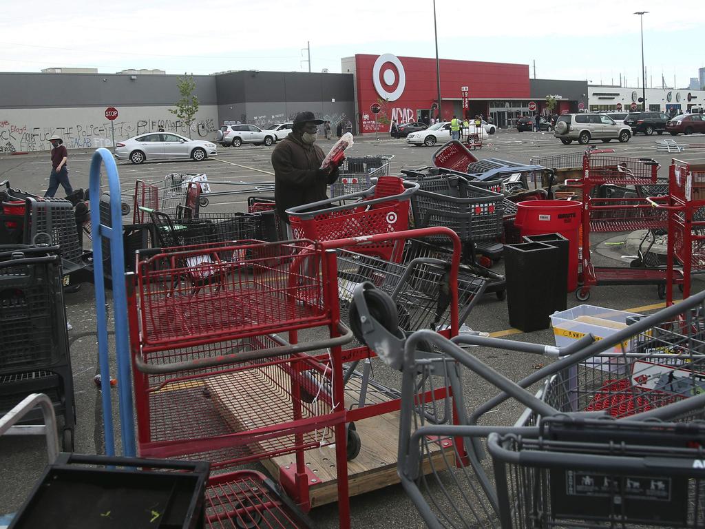 Shopping carts strewn outside Target. Picture: Picture: Jim Mone/AP