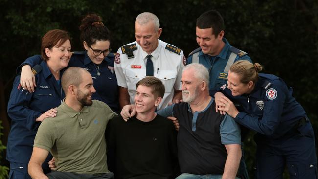 Ben Morgan, from Mt Annan (front centre) who almost died from cardiac arrest was reunited with the paramedics and passers by who saved his life. (back L-R) Gabrielle O'Dea, Clare Ramnac, David Kynaston, David Ipsen and Jemma Murphy. (front L-R) Thomas Finch, Ben Morgan and Ron McPherson. Debra was unable to attend at the time. Picture: Robert Pozo