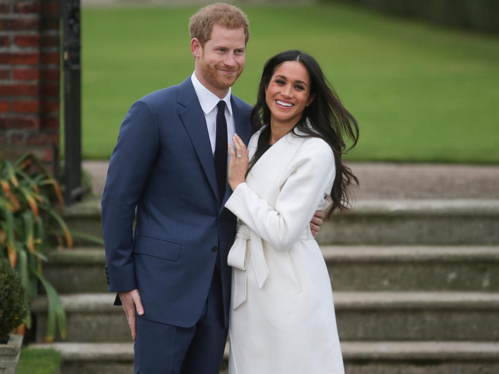 Prince Harry and Meghan Markle pose in the Sunken Garden at Kensington Palace following their engagement in 2017. Picture: Daniel Leal-Olivas