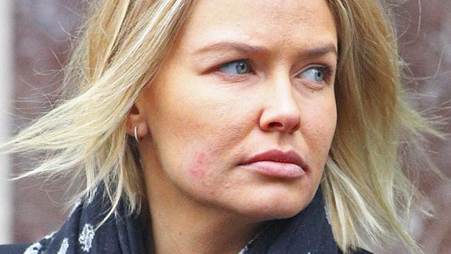 A barefaced Lara Bingle steps out in New York City to run errands.