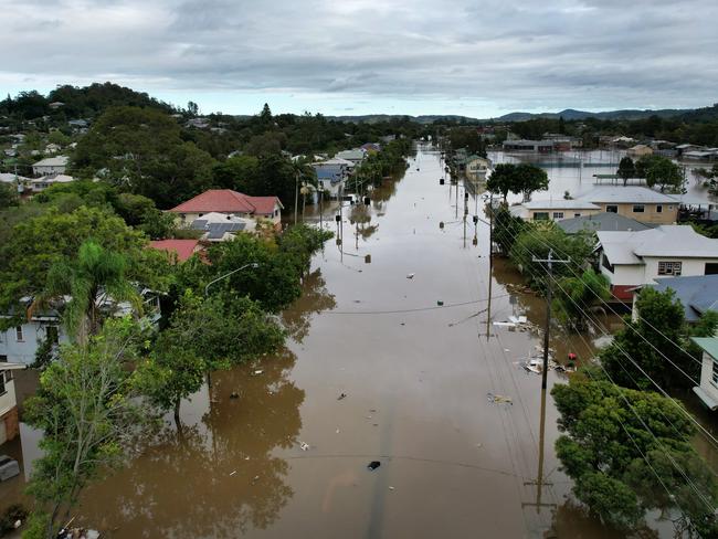 An aerial drone view of houses in Lismore surrounded by floodwater earlier this year. Picture: Dan Peled/Getty Images